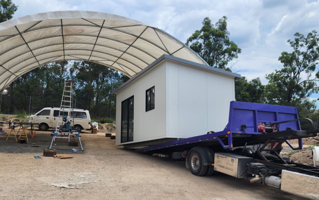 Tilt tray loading up a tiny home